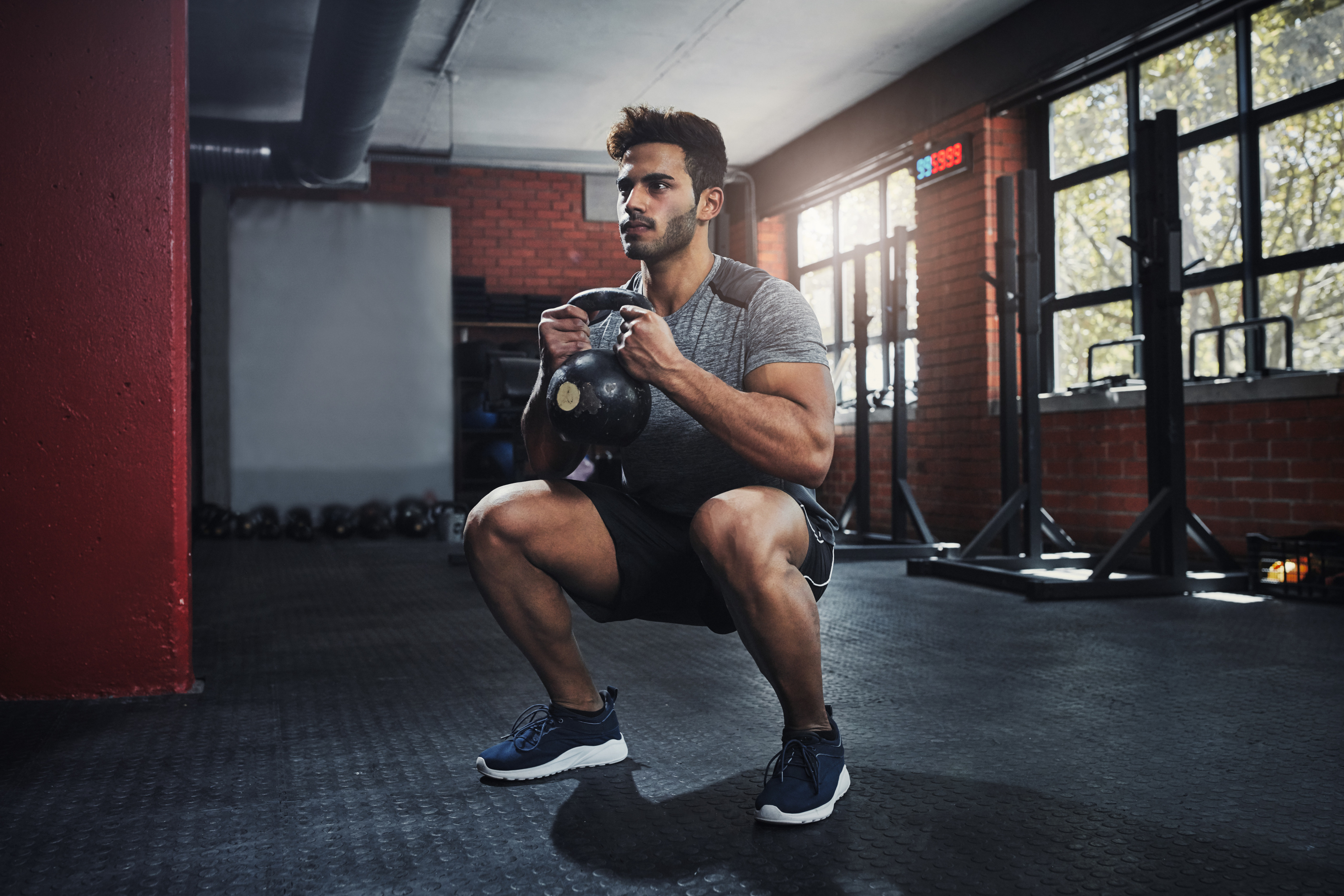 man fitness exercise with kettlebell squat club muscle wellness healthy body energy training strong person weightlifting power bodybuilding workout gym sport
